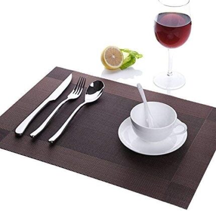 Shop our stylish brown heat-resistant placemats! Elevate your dining experience with this set of 6 woven vinyl mats, easy to clean. Order now