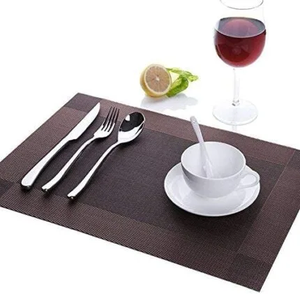 Shop our stylish brown heat-resistant placemats! Elevate your dining experience with this set of 6 woven vinyl mats, easy to clean. Order now